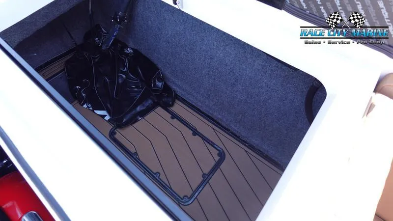 Slide: The Image of Storage compartment of 2025 Nautique Super Air Nautique GS22 boat. - 14