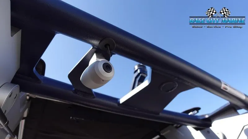 Slide: The Image of 2025 Nautique Super Air Nautique GS22 boat camera detail under blue sky. - 16