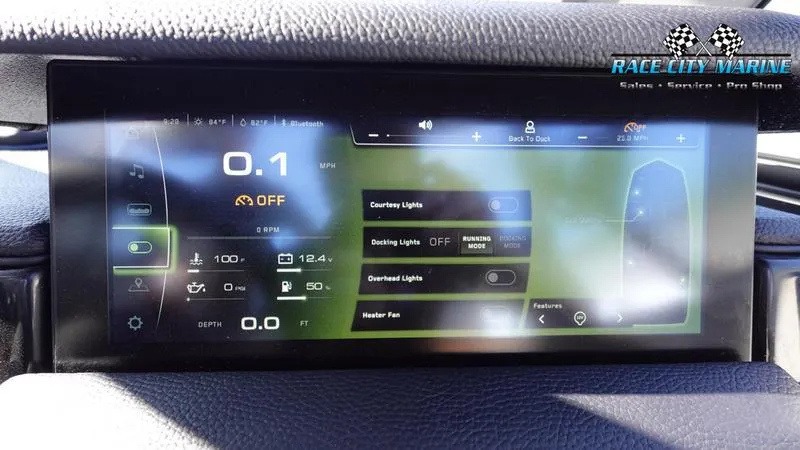 Slide: The Image of 2025 Nautique Super Air Nautique GS22 dashboard display with control settings and indicators. - 23