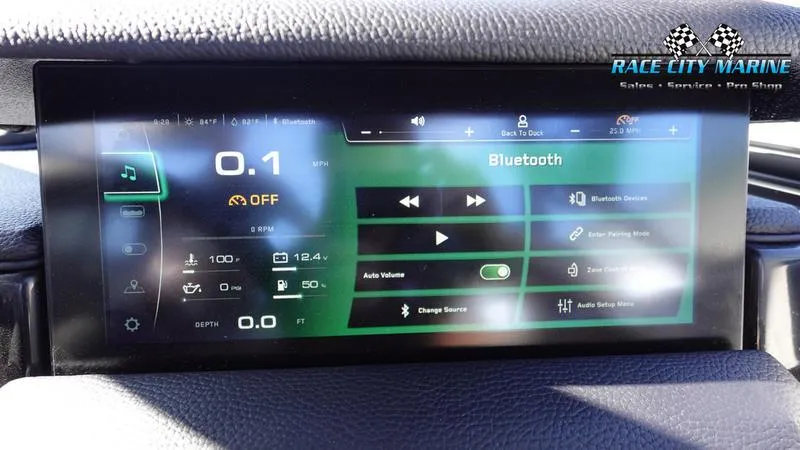 Slide: The Image of 2025 Nautique Super Air Nautique GS22 dashboard with Bluetooth and control settings. - 26