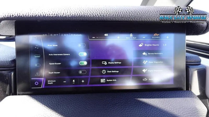 Slide: The Image of 2025 Nautique Super Air Nautique GS22 touchscreen display with various control settings. - 27