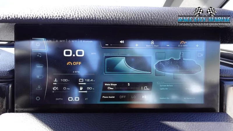 Slide: The Image of Dashboard display of 2025 Nautique Super Air Nautique GS22 boat with control settings. - 28