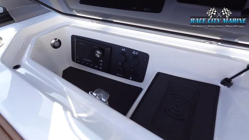 Slide: The Image of 2025 Nautique Super Air Nautique GS22 control panel in a sleek white interior. - 31