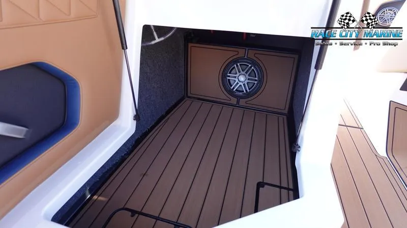 Slide: The Image of 2025 Nautique Super Air Nautique GS22 interior with custom flooring and speaker system. - 38