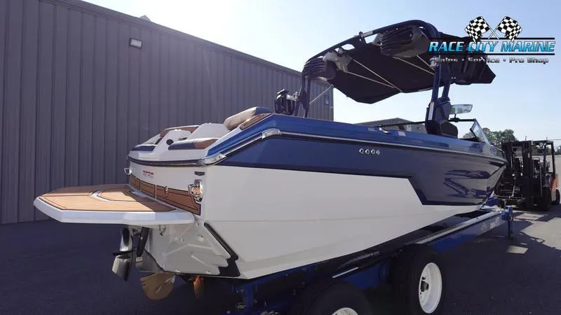 Slide: The Image of 2025 Nautique Super Air Nautique GS22 boat on trailer at Race City Marine. - 7