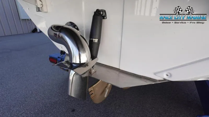Slide: The Image of 2025 Nautique Super Air Nautique GS22 boat exhaust and trim detail. - 8