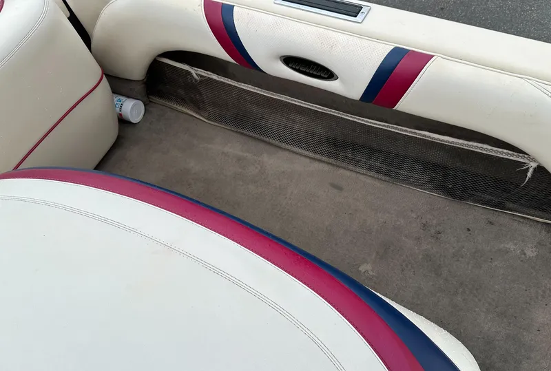 Slide: The Image of Interior of a 2000 Malibu Response LXi boat with white and red upholstery. - 16