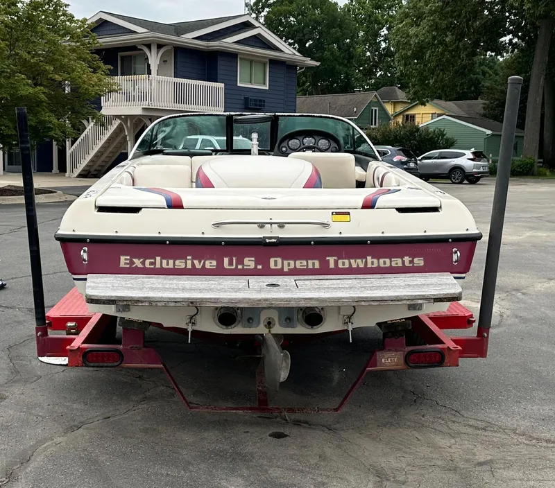 Slide: The Image of 2000 Malibu Response LXi boat on trailer, labeled "Exclusive U.S. Open Towboats." - 5