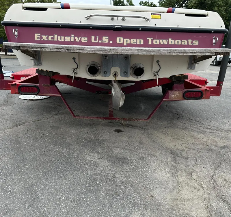 Slide: The Image of 2000 Malibu Response LXi boat on trailer, labeled "Exclusive U.S. Open Towboats." - 6