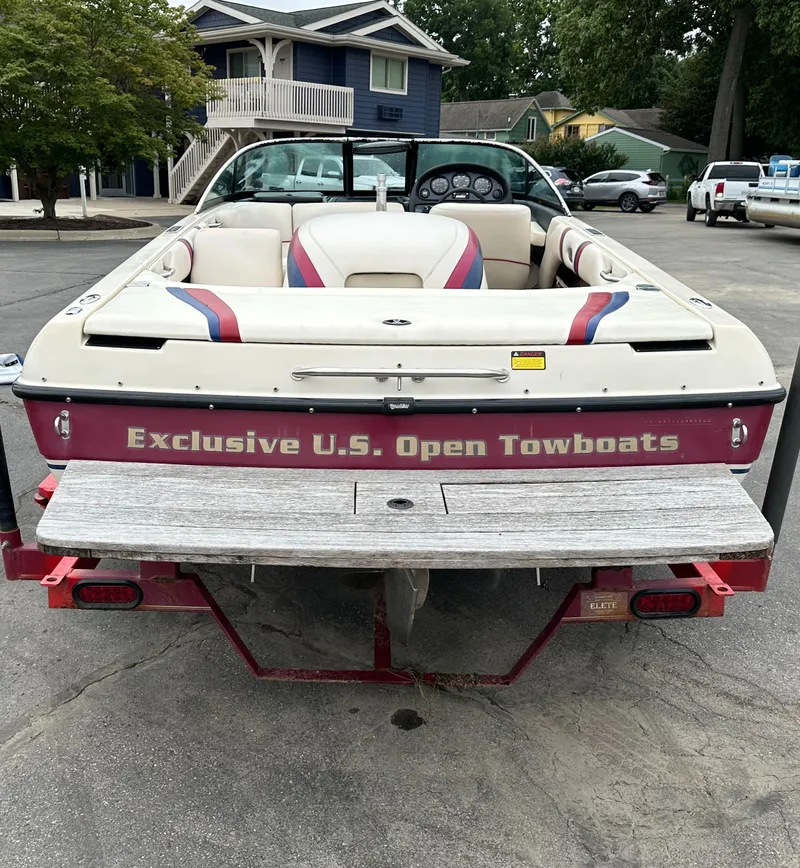 Slide: The Image of 2000 Malibu Response LXi boat, "Exclusive U.S. Open Towboats" branding, parked outdoors. - 7