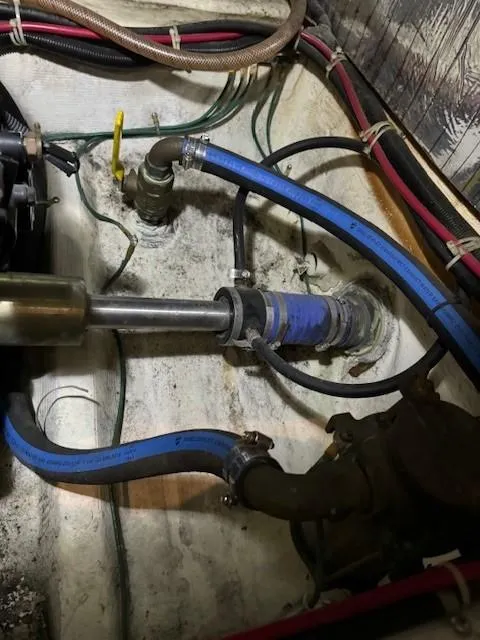 Slide: The Image of Engine compartment of 2001 Carver 396 Motoryacht with visible hoses and fittings. - 18