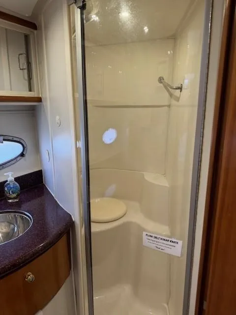 Slide: The Image of 2001 Carver 396 Motoryacht bathroom with shower and sink. - 14