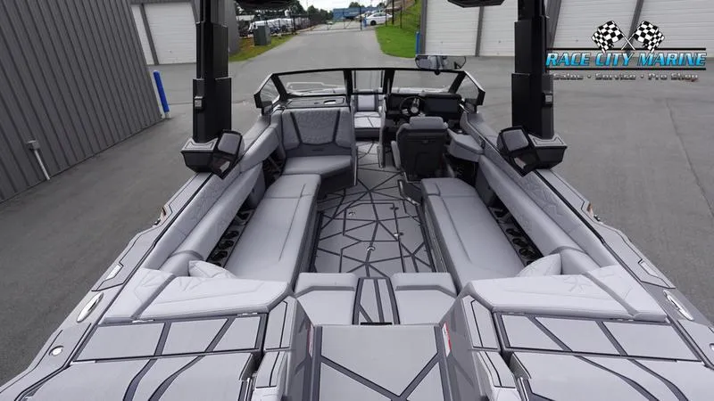 Slide: The Image of 2025 Nautique Super Air Nautique G25 Paragon interior with sleek, modern design and spacious seating. - 13