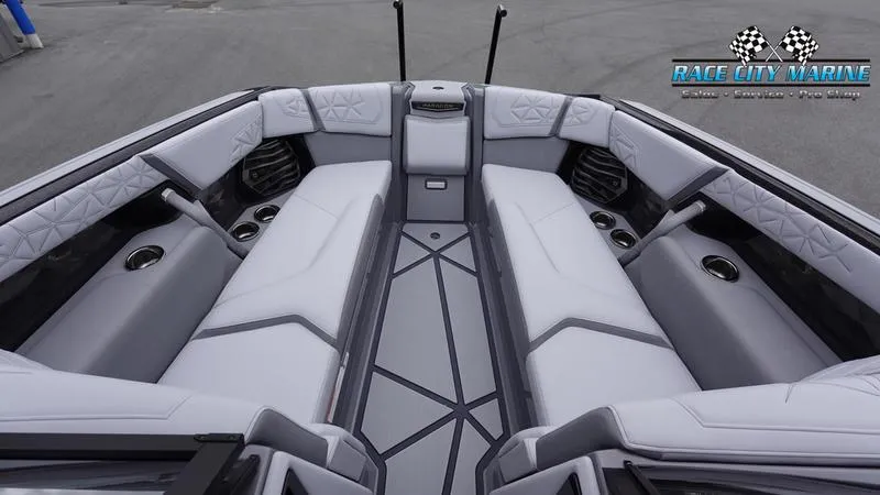Slide: The Image of 2025 Nautique Super Air Nautique G25 Paragon interior with luxurious seating and cup holders. - 19