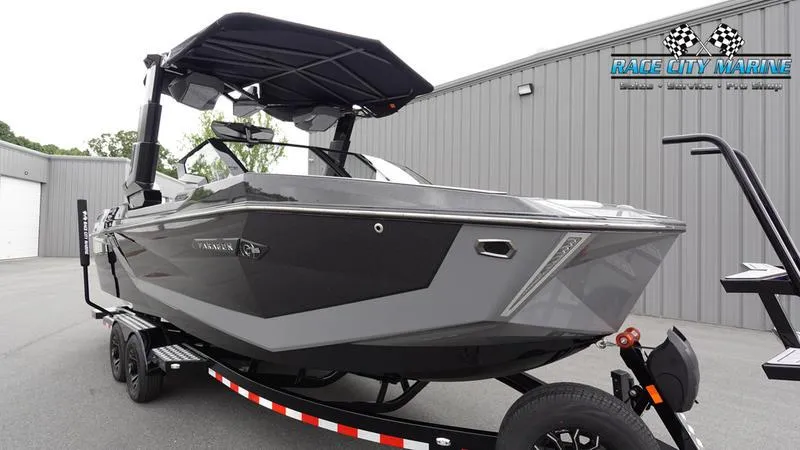 Slide: The Image of 2025 Nautique Super Air Nautique G25 Paragon boat on trailer at Race City Marine. - 2