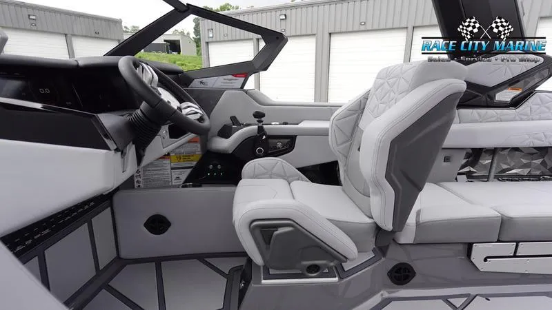 Slide: The Image of 2025 Nautique Super Air Nautique G25 Paragon interior with modern design and luxurious seating. - 23