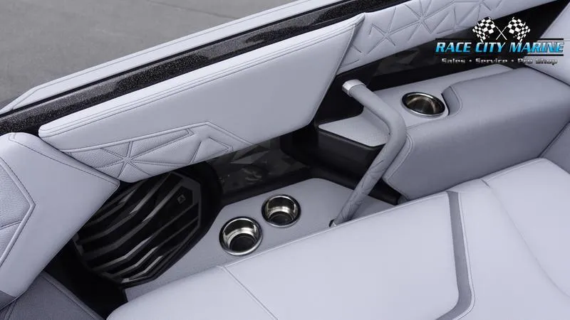 Slide: The Image of 2025 Nautique Super Air Nautique G25 Paragon interior with cup holders and premium seating. - 25