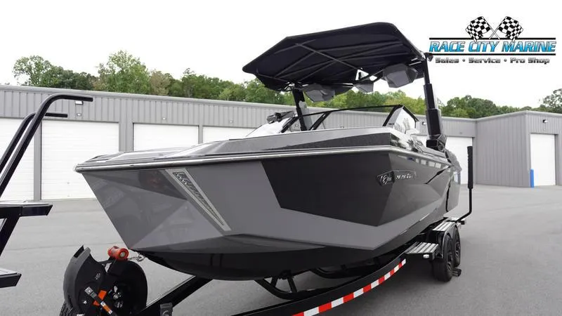 Slide: The Image of 2025 Nautique Super Air Nautique G25 Paragon boat on trailer at Race City Marine. - 3