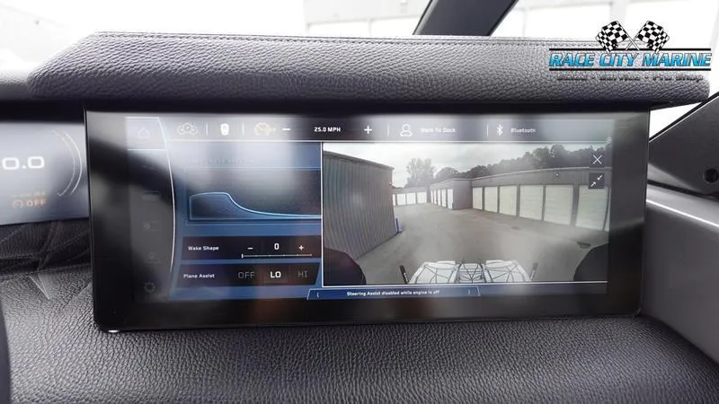 Slide: The Image of 2025 Nautique Super Air Nautique G25 Paragon dashboard display with rearview camera and controls. - 36