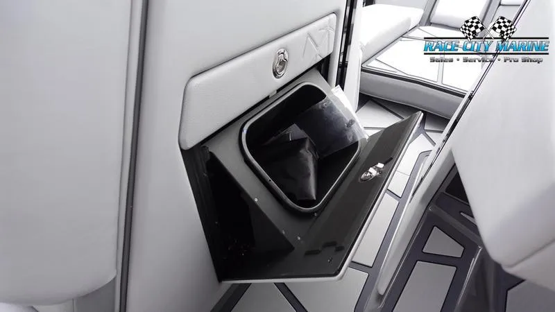 Slide: The Image of 2025 Nautique Super Air Nautique G25 Paragon interior storage compartment. - 48