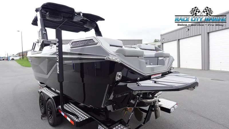 Slide: The Image of 2025 Nautique Super Air Nautique G25 Paragon boat on trailer, Race City Marine. - 5