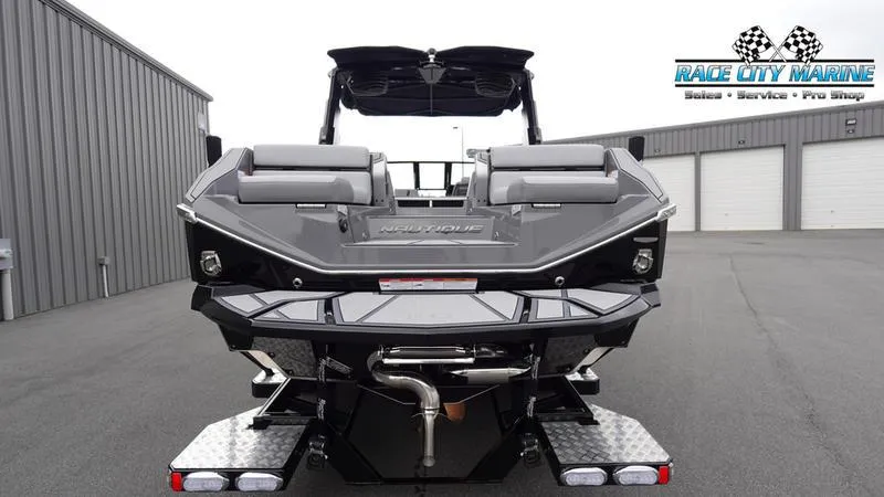 Slide: The Image of 2025 Nautique Super Air Nautique G25 Paragon boat rear view at Race City Marine. - 7