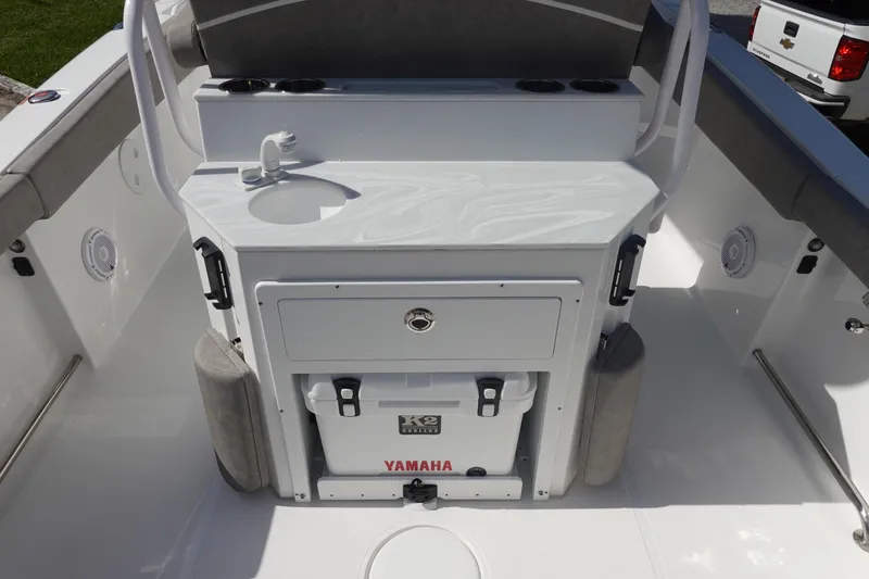 Slide: The Image of 2025 Sea Hunt Ultra 265 SE boat interior with sink and Yamaha cooler. - 14