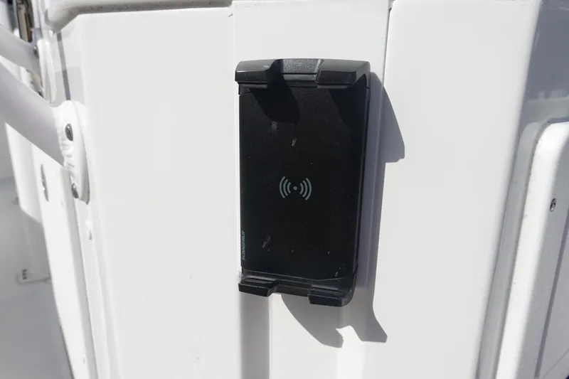 Slide: The Image of Black wireless charging pad on 2025 Sea Hunt Ultra 265 SE boat. - 18