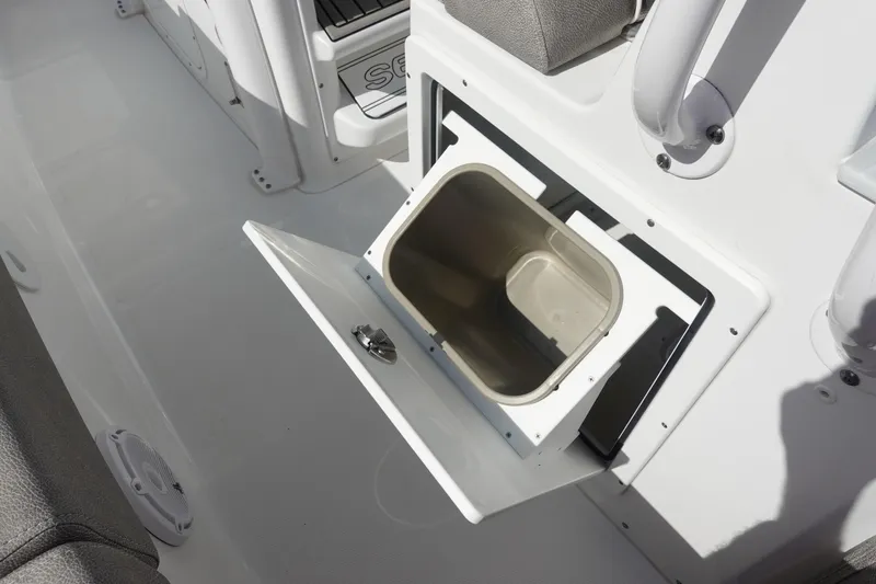 Slide: The Image of Open storage compartment on 2025 Sea Hunt Ultra 265 SE boat deck. - 19