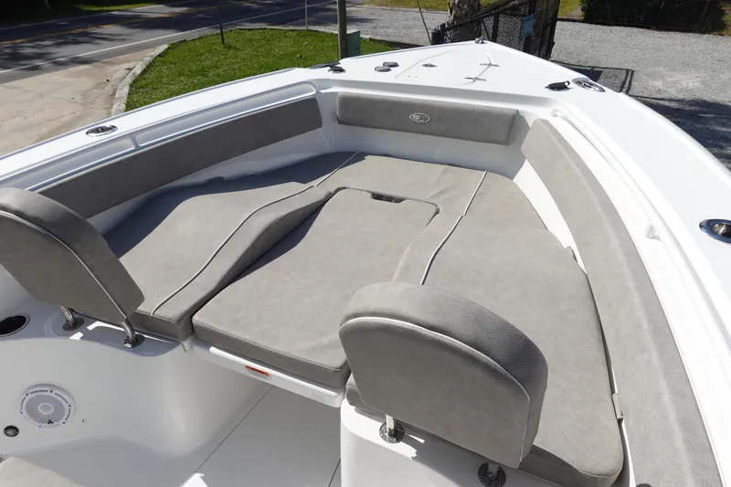 Slide: The Image of 2025 Sea Hunt Ultra 265 SE boat with spacious cushioned seating area. - 30