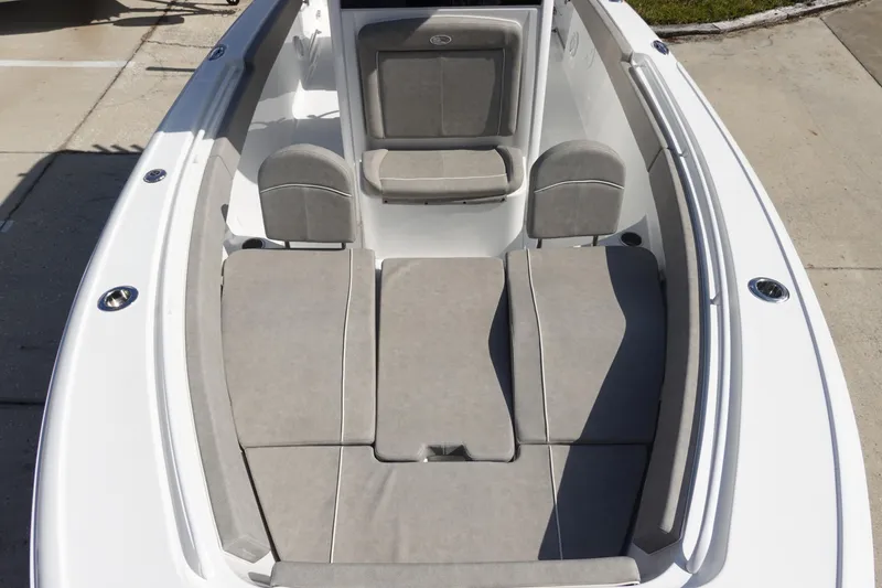 Slide: The Image of 2025 Sea Hunt Ultra 265 SE boat interior with cushioned seating and sleek design. - 31