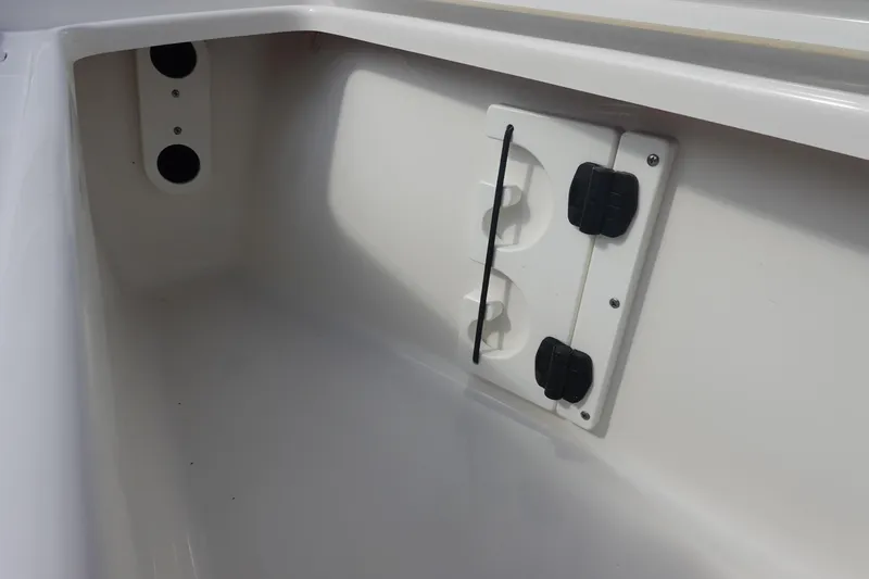 Slide: The Image of Interior compartment of 2025 Sea Hunt Ultra 265 SE boat, featuring storage and utility fixtures. - 34