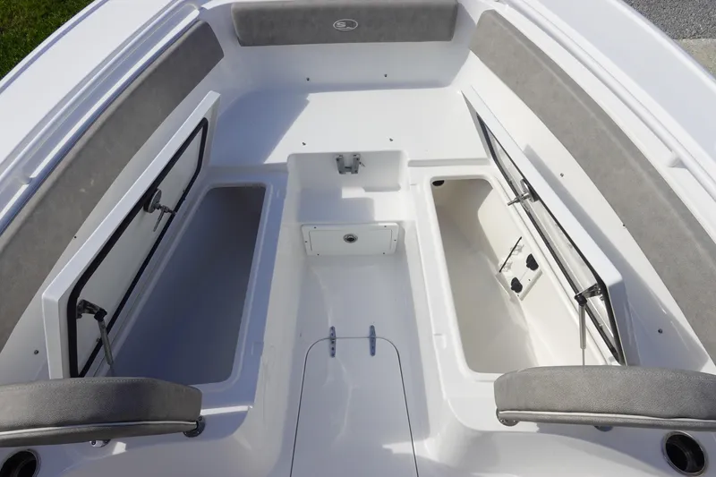 Slide: The Image of 2025 Sea Hunt Ultra 265 SE boat interior with open storage compartments. - 35
