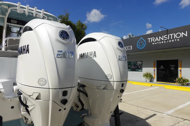 Slide: The Image of Twin Yamaha 200 engines on a 2025 Sea Hunt Ultra 265 SE at Transition Watersports. - 6