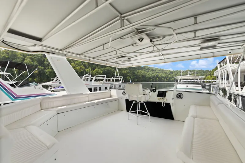 Slide: The Image of Spacious deck of 2001 Stardust Cruisers 18 x 100 houseboat with seating and helm. - 15