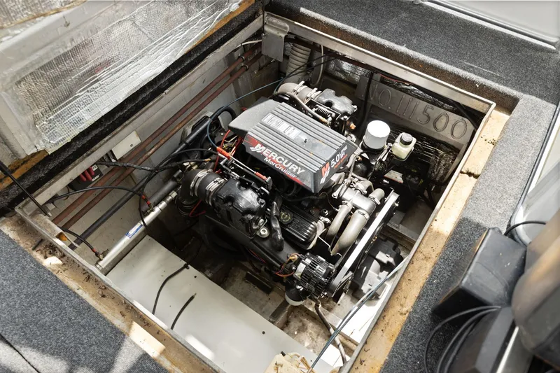 Slide: The Image of Engine compartment of a 2001 Stardust Cruisers 18 x 100 houseboat with Mercury engine. - 24