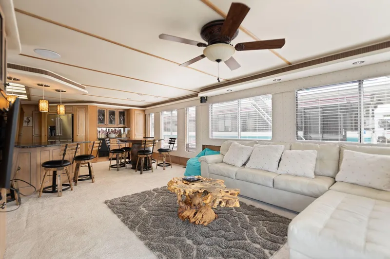 Slide: The Image of Luxurious 2001 Stardust Cruisers houseboat interior with modern furnishings and natural wood accents. - 28