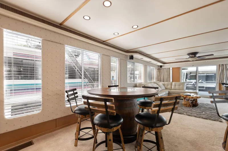 Slide: The Image of Luxurious 2001 Stardust Cruisers houseboat interior with dining area and comfortable seating. - 36