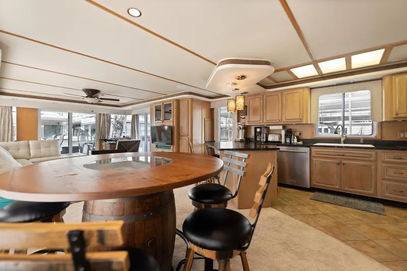 Slide: The Image of Luxurious 2001 Stardust Cruisers houseboat interior with kitchen and dining area. - 37