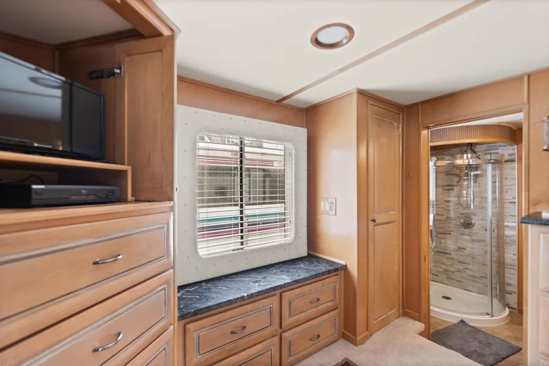 Slide: The Image of Interior of 2001 Stardust Cruisers houseboat with wood cabinetry and modern shower. - 41