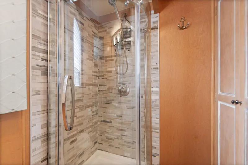 Slide: The Image of Modern shower in 2001 Stardust Cruisers houseboat with glass door and tiled walls. - 43