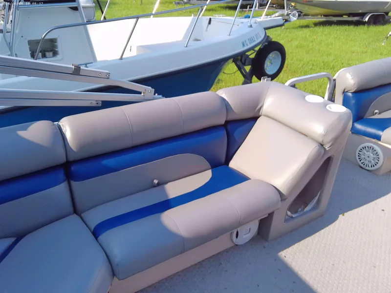 Slide: The Image of 2006 Odyssey Pontoons 218 DLX interior with gray and blue seating. - 4