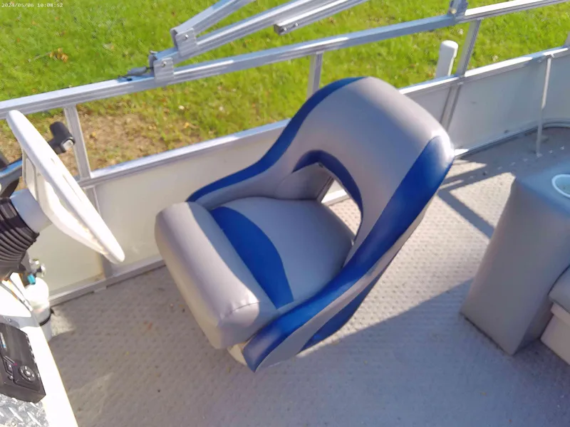 Slide: The Image of 2006 Odyssey Pontoons 218 DLX captain's chair with blue and gray upholstery. - 6
