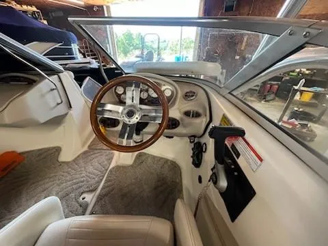 Slide: The Image of 2009 Glastron GT205 boat interior with steering wheel and dashboard. - 6