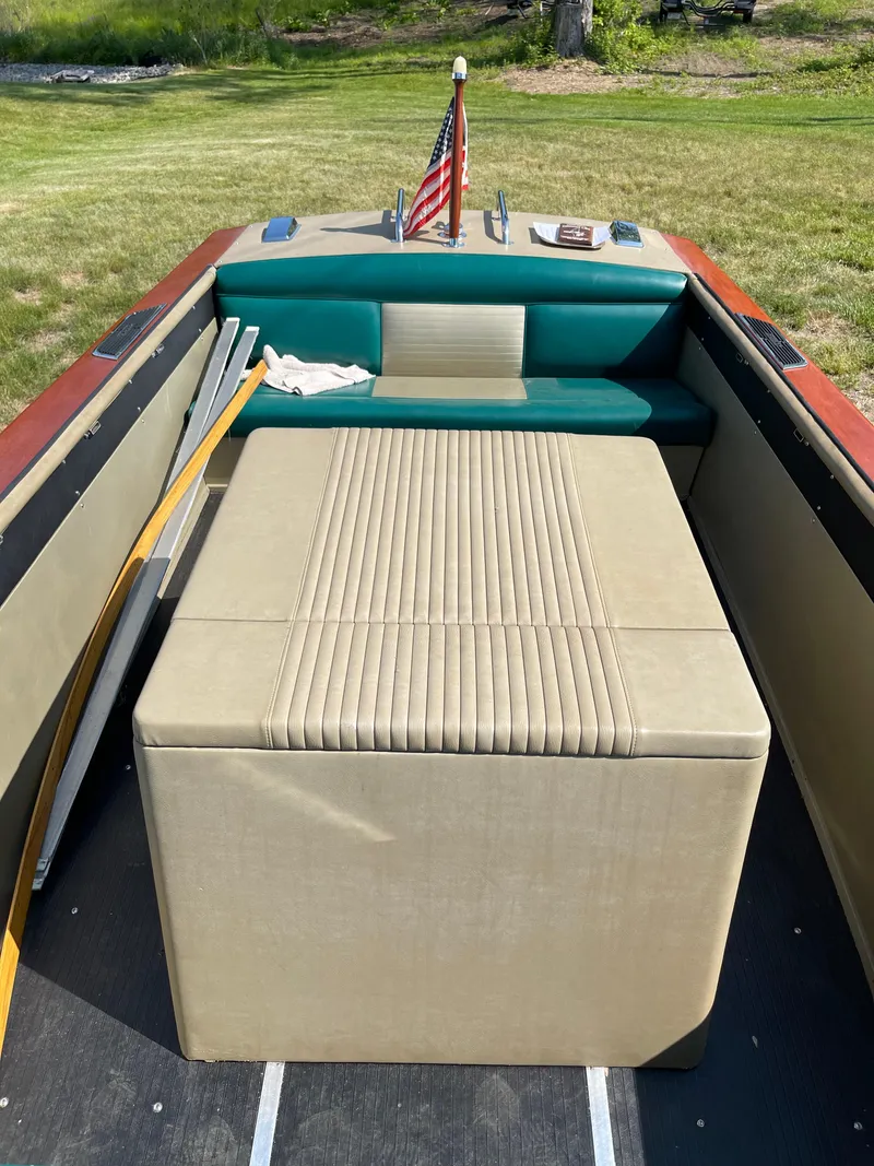 Slide: The Image of 1966 Century Resorter boat interior with beige seating and American flag. - 20