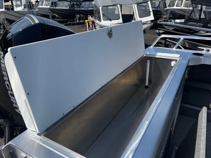 Slide: The Image of 2024 Thunder Jet 24 Alexis Pro boat with open storage compartment. - 12