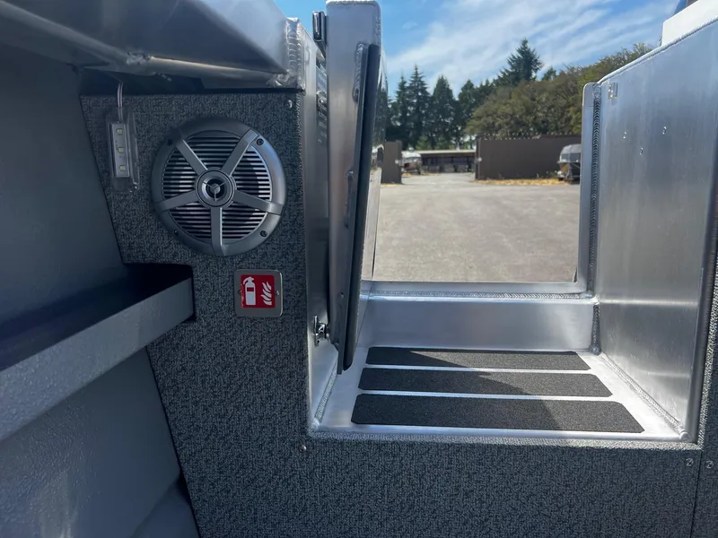 Slide: The Image of 2024 Thunder Jet 24 Alexis Pro boat interior with speaker and safety sign. - 14