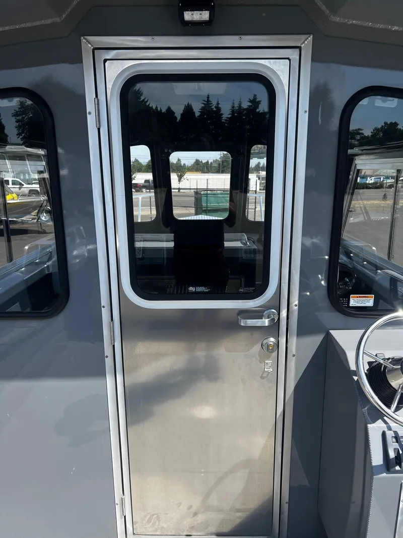 Slide: The Image of 2024 Thunder Jet 24 Alexis Pro boat cabin door with windows. - 15