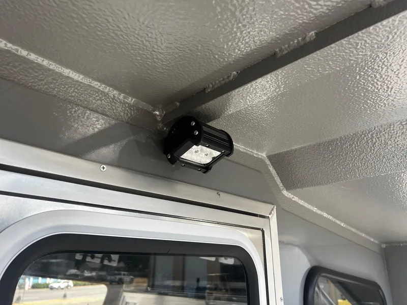 Slide: The Image of 2024 Thunder Jet 24 Alexis Pro interior with mounted light fixture. - 16