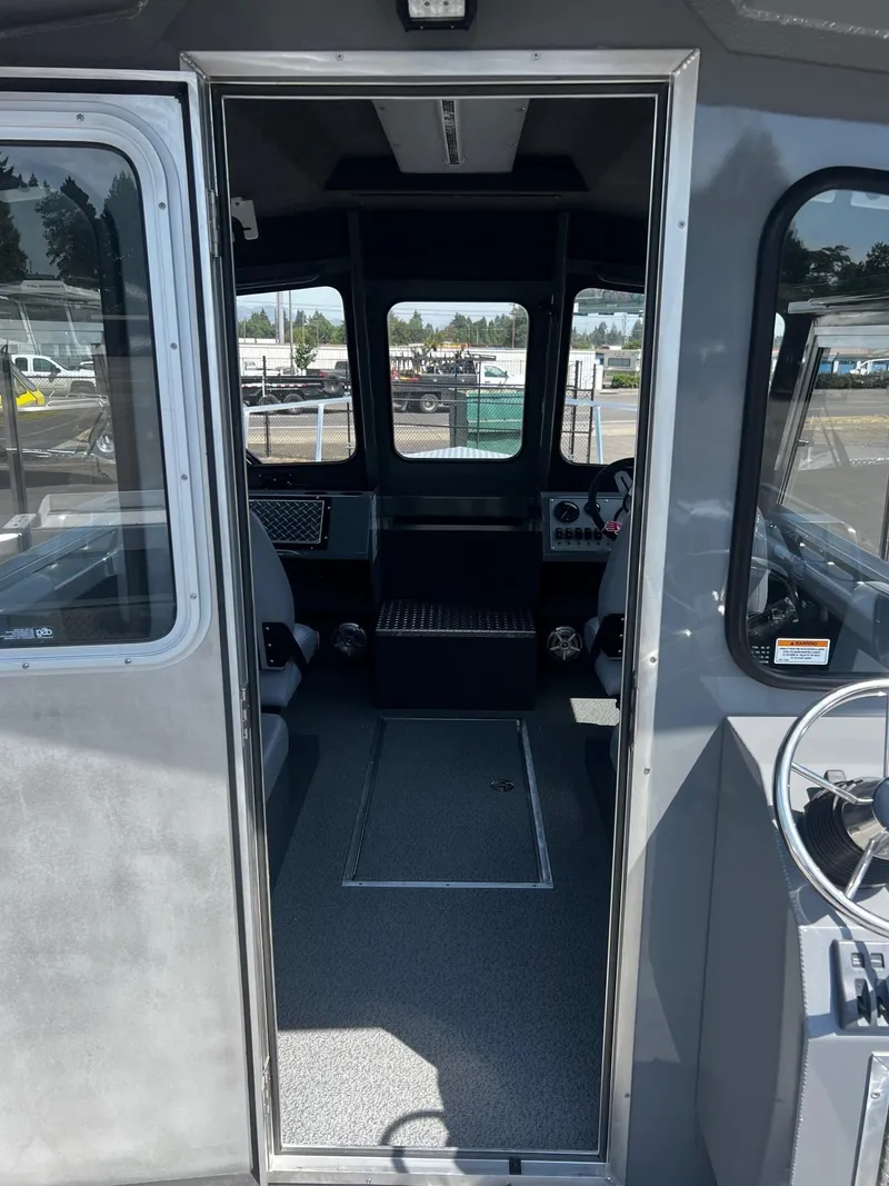 Slide: The Image of 2024 Thunder Jet 24 Alexis Pro boat interior, featuring spacious cabin and modern controls. - 17